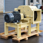 Industrial hammer mills for grinding and reducing suitable waste materials for easier handling